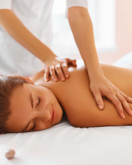 Hotel in Bramberg: Smaragdhotel Tauernblick Woman receiving relaxing back massage on massage table